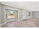 Living room with bay window and wood-look floors at 504 68Th Avenue W Dr, Bradenton, FL 34207