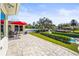 Outdoor patio with seating area, red umbrella, and water views at 504 68Th Avenue W Dr, Bradenton, FL 34207