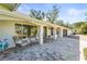 Relaxing porch with wicker chairs and decorative birds at 504 68Th Avenue W Dr, Bradenton, FL 34207