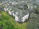 An aerial shot showcasing the condo building's location and architecture at 5180 Northridge Rd # 211, Sarasota, FL 34238