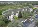 Condo building with parking and surrounding landscape at 5180 Northridge Rd # 211, Sarasota, FL 34238