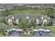 Aerial view of condo building, showing building, parking lot and landscaping at 5180 Northridge Rd # 211, Sarasota, FL 34238