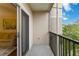 Private screened balcony overlooking lush greenery at 5180 Northridge Rd # 211, Sarasota, FL 34238