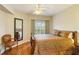 Spacious bedroom with large window, hardwood floors, and a comfy bed at 5180 Northridge Rd # 211, Sarasota, FL 34238