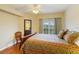 Spacious bedroom with large window and hardwood floors at 5180 Northridge Rd # 211, Sarasota, FL 34238