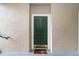 Green condo entry door with a brown welcome mat at 5180 Northridge Rd # 211, Sarasota, FL 34238