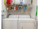 Stackable washer and dryer in well-lit laundry room at 5180 Northridge Rd # 211, Sarasota, FL 34238