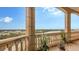 Spacious balcony boasting stunning water views and lush landscaping at 5531 Cannes Cir # 802, Sarasota, FL 34231