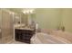 Spa-like bathroom with a soaking tub, shower, and granite countertops at 5531 Cannes Cir # 802, Sarasota, FL 34231