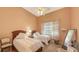 Well-lit bedroom featuring two twin beds and a ceiling fan at 5531 Cannes Cir # 802, Sarasota, FL 34231