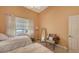 Cozy bedroom with two twin beds, ample light and a full-length mirror at 5531 Cannes Cir # 802, Sarasota, FL 34231