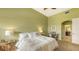 Spacious bedroom with a queen-size bed and ensuite bathroom access at 5531 Cannes Cir # 802, Sarasota, FL 34231