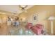 Dining room with a glass table, chairs and kitchen passthrough at 5531 Cannes Cir # 802, Sarasota, FL 34231