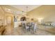 Bright dining room with a glass table and chandelier at 5531 Cannes Cir # 802, Sarasota, FL 34231