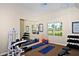 Exercise room with weights, mats, and mirror at 5531 Cannes Cir # 802, Sarasota, FL 34231