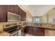 Updated kitchen with stainless steel appliances and granite countertops at 5531 Cannes Cir # 802, Sarasota, FL 34231