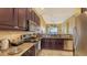 Kitchen boasts stainless steel appliances and ample granite counter space at 5531 Cannes Cir # 802, Sarasota, FL 34231