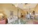 Open living and dining area with ample natural light and access to a balcony at 5531 Cannes Cir # 802, Sarasota, FL 34231