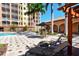 Spacious pool deck with comfortable lounge chairs at 5531 Cannes Cir # 802, Sarasota, FL 34231