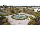 Community fountain with landscaping and seating at 5539 Holiday Park Blvd, North Port, FL 34287