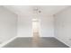 Simple bedroom with grey walls, grey tile floors, and ceiling fan at 5823 26Th W St, Bradenton, FL 34207