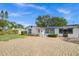 House's front view showcasing its design and parking at 5823 26Th W St, Bradenton, FL 34207