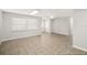 Bright living room featuring tile floors and window with blinds at 5823 26Th W St, Bradenton, FL 34207