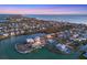 Coastal community with waterfront homes and lush landscaping at 608 Bayview Dr, Longboat Key, FL 34228