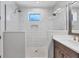 Bathroom with a walk-in shower and modern vanity at 608 Bayview Dr, Longboat Key, FL 34228