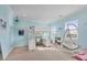 Charming bedroom with built-in loft bed and hanging chair at 608 Bayview Dr, Longboat Key, FL 34228