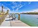 Private boat dock with chairs overlooking the water at 608 Bayview Dr, Longboat Key, FL 34228