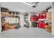 Spacious garage with overhead storage and ample room for vehicles and equipment at 608 Bayview Dr, Longboat Key, FL 34228