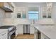 Gourmet kitchen with stainless steel appliances and a view at 608 Bayview Dr, Longboat Key, FL 34228