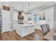 Modern kitchen featuring white cabinetry, quartz countertops, and an island at 608 Bayview Dr, Longboat Key, FL 34228