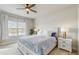 Comfortable bedroom with a bed, nightstands, and a view of the backyard at 6217 116Th E Ave, Parrish, FL 34219