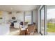 Bright breakfast nook with a glass-top table and wicker chairs, adjacent to the kitchen at 6217 116Th E Ave, Parrish, FL 34219