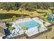 Resort-style pool with lounge chairs and palm trees in a gated community at 6217 116Th E Ave, Parrish, FL 34219