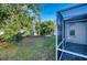 View of backyard through screened patio at 6334 Yellowtop Dr, Lakewood Ranch, FL 34202