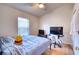 Bedroom with wood floors, a TV, and a desk at 6334 Yellowtop Dr, Lakewood Ranch, FL 34202