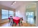 Dining area with red tablecloth and view of kitchen at 6334 Yellowtop Dr, Lakewood Ranch, FL 34202