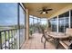 Spacious screened balcony with patio furniture and lake view at 6450 Watercrest Way # 304, Lakewood Ranch, FL 34202