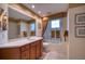 Clean bathroom with a tub and shower, and wood cabinets at 6450 Watercrest Way # 304, Lakewood Ranch, FL 34202