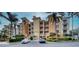 Condo building with ample parking and lush landscaping at 6450 Watercrest Way # 304, Lakewood Ranch, FL 34202