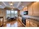 Modern kitchen with granite countertops and wood cabinets at 6450 Watercrest Way # 304, Lakewood Ranch, FL 34202