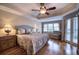 Bright main bedroom with hardwood floors and water views at 6450 Watercrest Way # 304, Lakewood Ranch, FL 34202