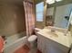 Clean bathroom with a tub, toilet and vanity with drawers at 6504 Bowdoin Pl # 15, Bradenton, FL 34207