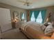 Lovely bedroom with a queen bed, two nightstands and window at 6504 Bowdoin Pl # 15, Bradenton, FL 34207