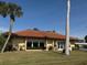 Community clubhouse with large windows and welcoming entry at 6504 Bowdoin Pl # 15, Bradenton, FL 34207