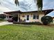 Single-story home with carport and well-maintained landscaping at 6504 Bowdoin Pl # 15, Bradenton, FL 34207