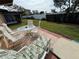 This patio features a table, chairs, and chaise lounge for relaxing at 6504 Bowdoin Pl # 15, Bradenton, FL 34207